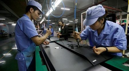 La actividad de las fábricas Chinas se expande más lentamente en diciembre, pero la confianza repunta